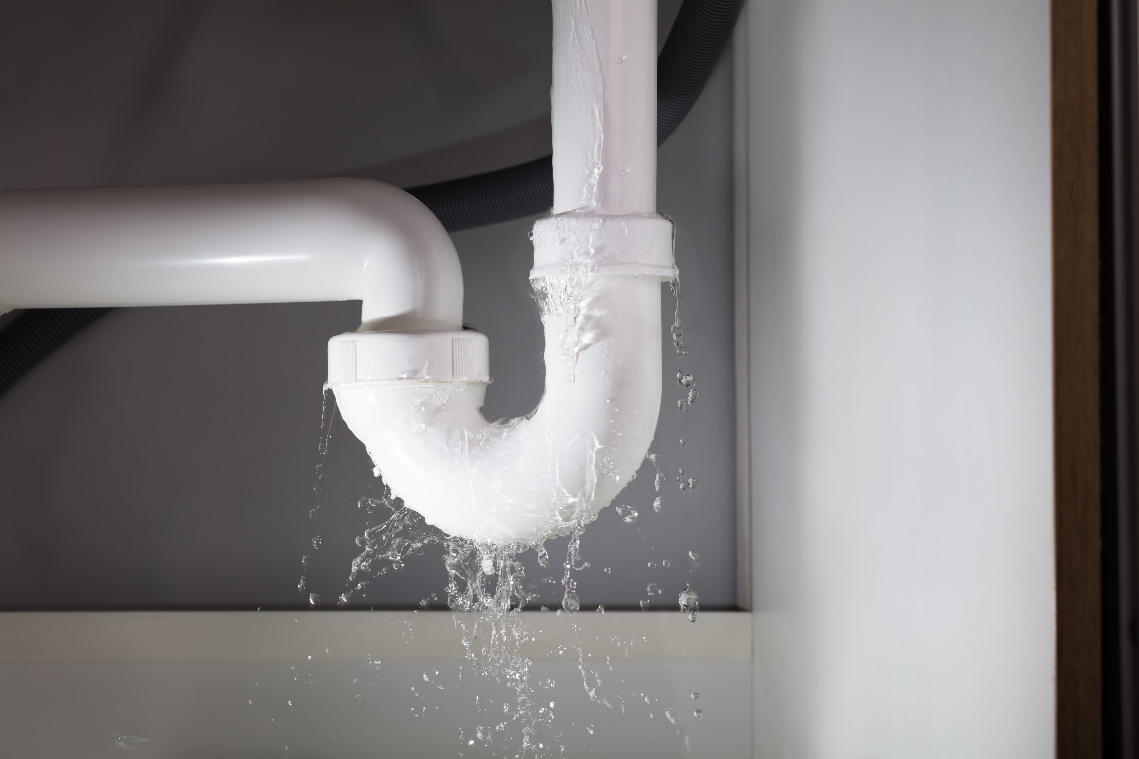 Leaking drain pipe under a sink